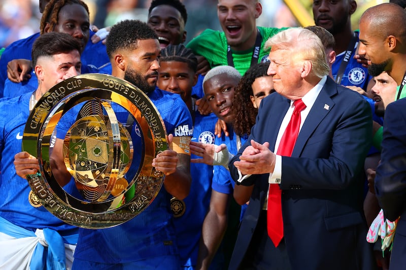 EAST RUTHERFORD, NEW JERSEY - JULY 13: Reece James of Chelsea looks towards U.S President Donald Trump as he prepares to lift the trophy following the FIFA Club World Cup 2025 final match between Chelsea FC and Paris Saint-Germain at MetLife Stadium on July 13, 2025 in East Rutherford, New Jersey. (Photo by Chris Brunskill/Fantasista/Getty Images)