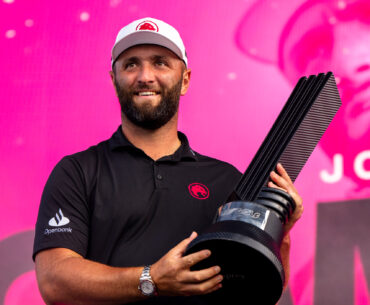 Jon Rahm poses with the LIV Golf Chicago trophy after winning in 2024