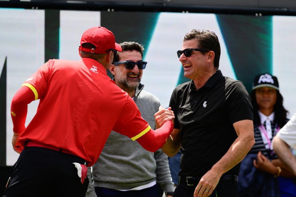 Scott O'Neil shakes hands with Sergio Garcia during LIV Golf Miami