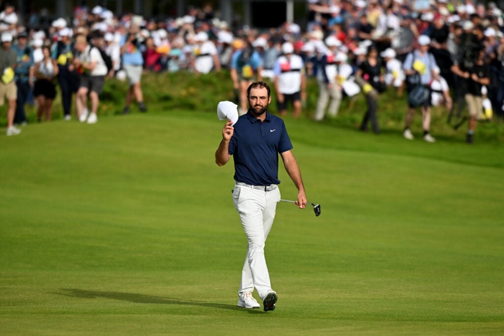 Scottie Scheffler acknowledges the crowd as he walks up 18 at Royal Portrush in the final round of The Open Championship