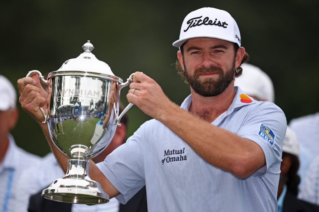 Cameron Young lifts the Wyndham Championship trophy