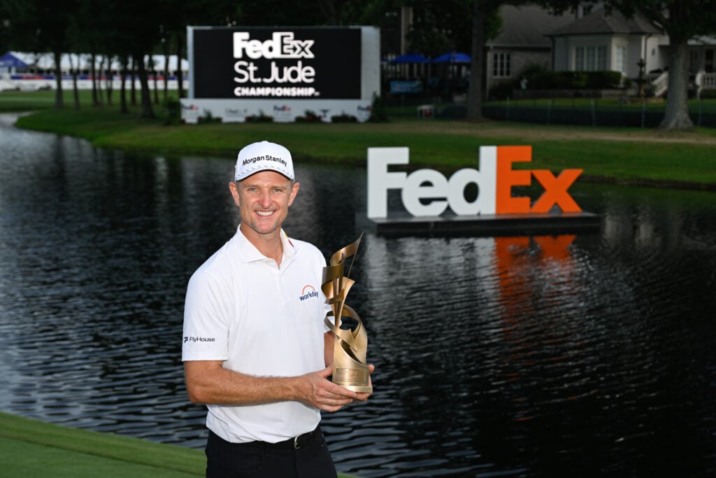 Justin Rose holds the FedEx St. Jude Championship trophy