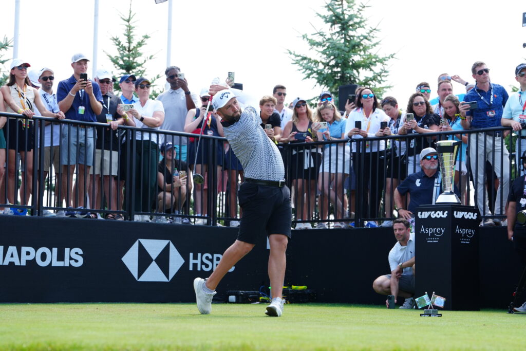 Jon Rahm plays a tee shot during the first round of LIV Golf Indianapolis