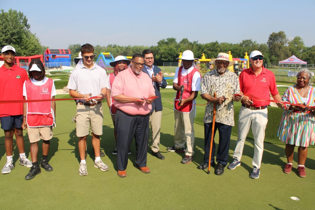 City leaders participate in the ceremonial ribbon-cutting to open the new 9-hole mini-golf course at Columbus Park, 5701 W. Jackson Blvd. in Austin on August 6.