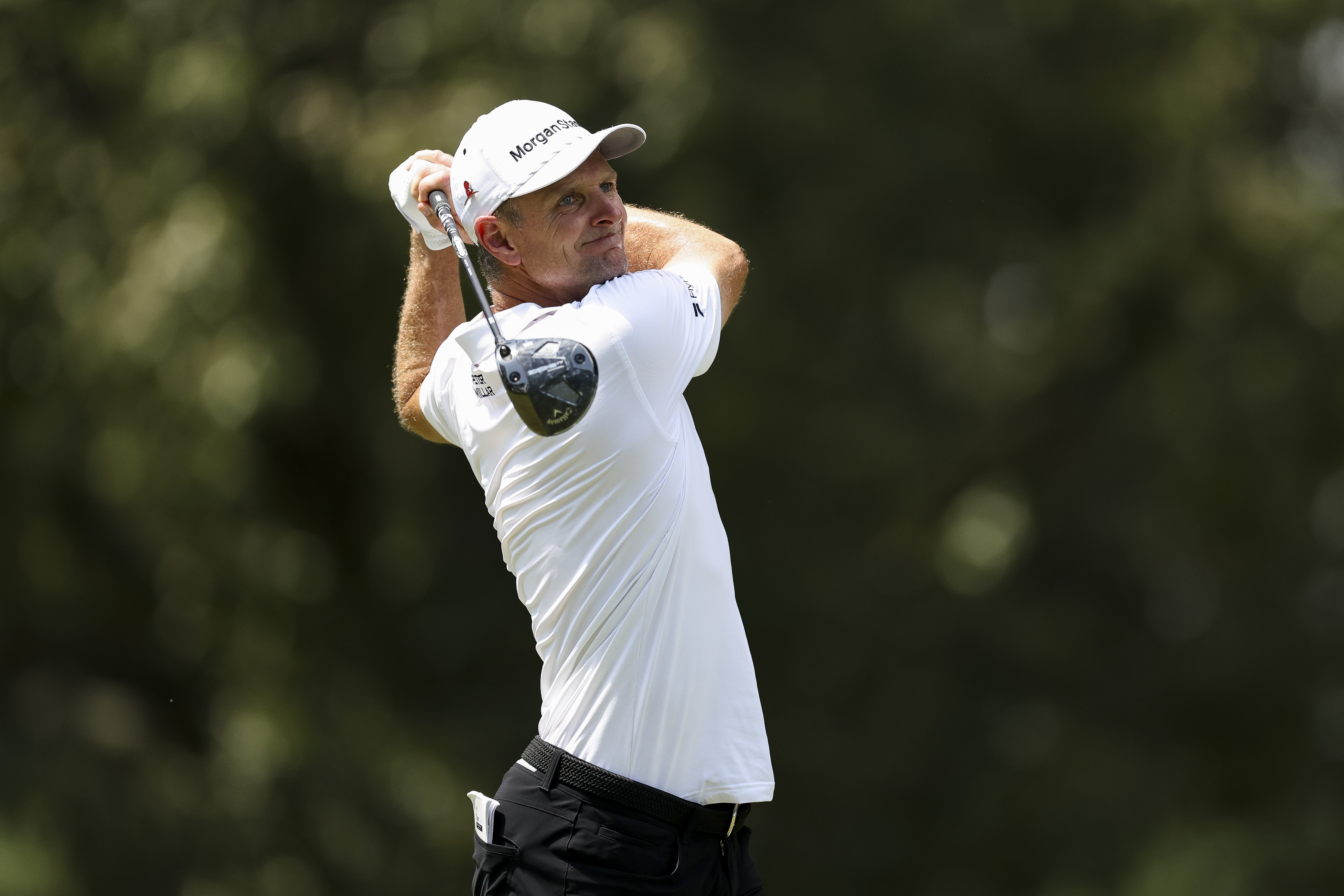 Justin Rose hits a driver