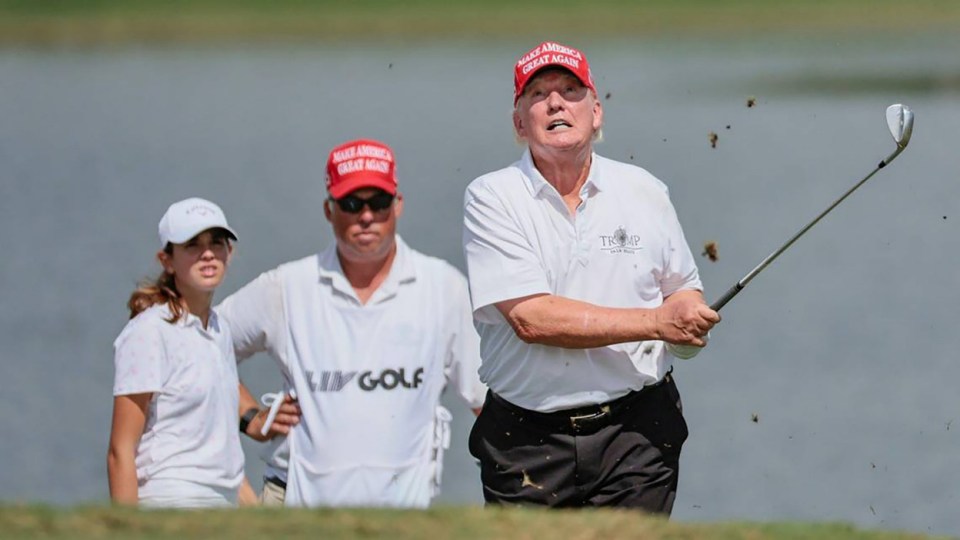 Former President Donald Trump hits out of the bunker during the LIV Golf Miami Team Championship Pro-Am Tournament at Trump National Doral Golf Club in Doral on Oct. 27, 2022. (Al Diaz/The Miami Herald/Tribune News Service via Getty Images)
