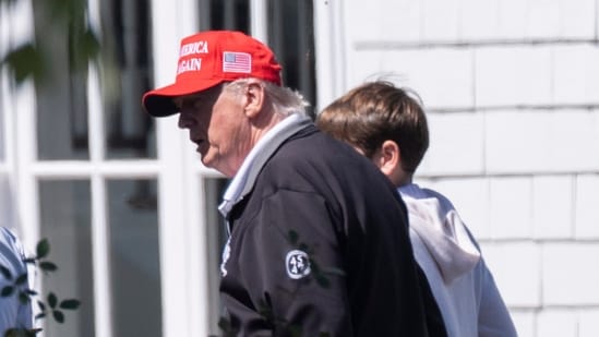 President Donald Trump, from left, walks with his grandson Spencer Trump and his granddaughter Kai Trump at the Trump National Golf Club in Sterling, Va., Saturday, Aug. 30.(AP)
