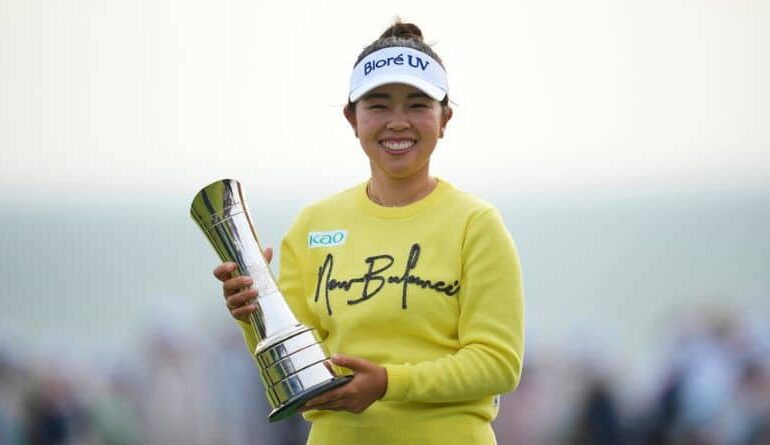 Miyu Yamashita of Japan poses with her trophy after winning the Women's British Open golf championship, at Royal Porthcawl Golf Club in Porthcawl, Wales, Sunday, Aug. 3, 2025. (AP Photo/Kin Cheung)