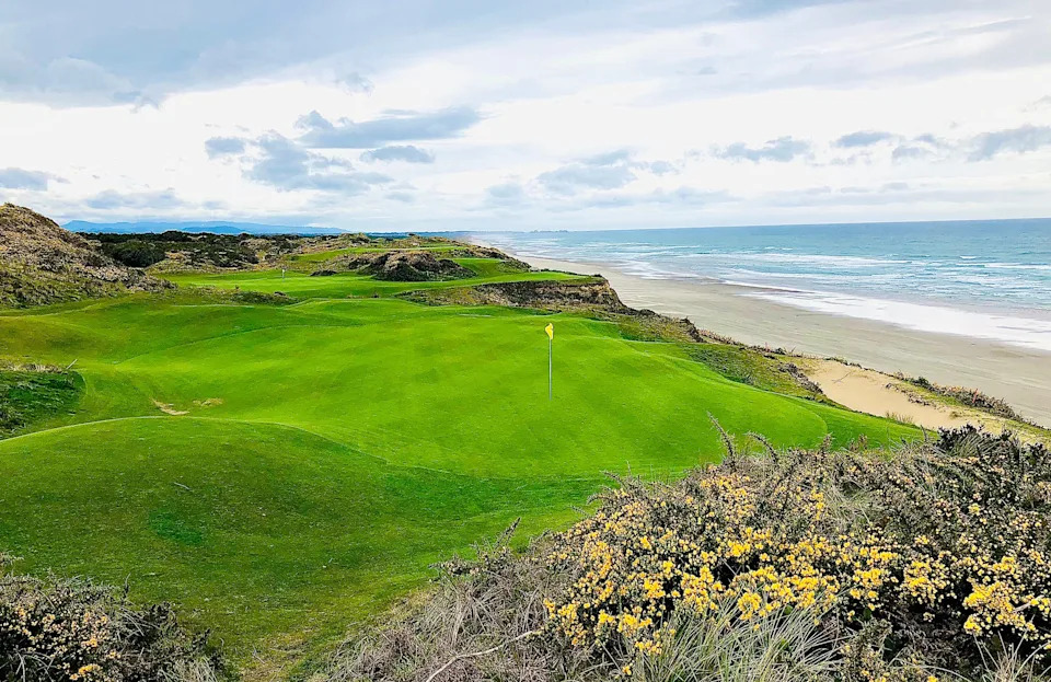 The par-3 11th of Pacific Dunes at Bandon Dunes Golf Resort in Oregon plays just atop the cliff above the Pacific Ocean.