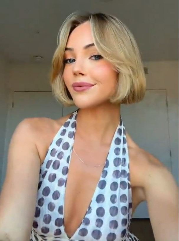 Woman with blonde bob haircut.