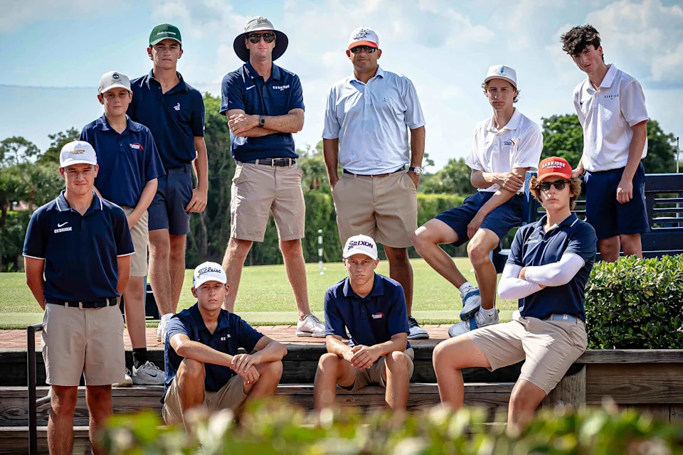 Oxbridge Academy Boys Golf team members with coaches Dan McLella, top row second from left and Jonah DelVillar, top row third from right, in a portrait at the Breakers West Country Club driving range in unincorporated Palm Beach County, Fla., on August 20, 2025.