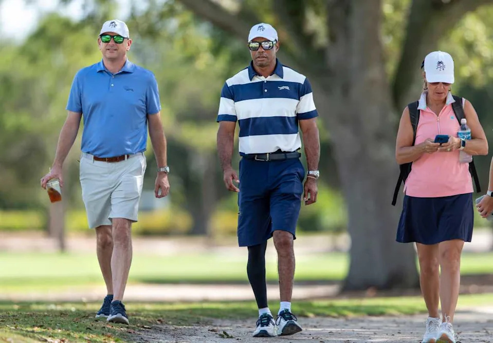 Tiger Woods, center, walks the course to watch his son Charlie Woods.GREG LOVETT&sol;PALM BEACH POST &sol; USA TODAY NETWORK via Imagn Images
