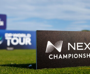 A Nexo Championship sign in the foreground with a DP World Tour sign surround a tee box in the background