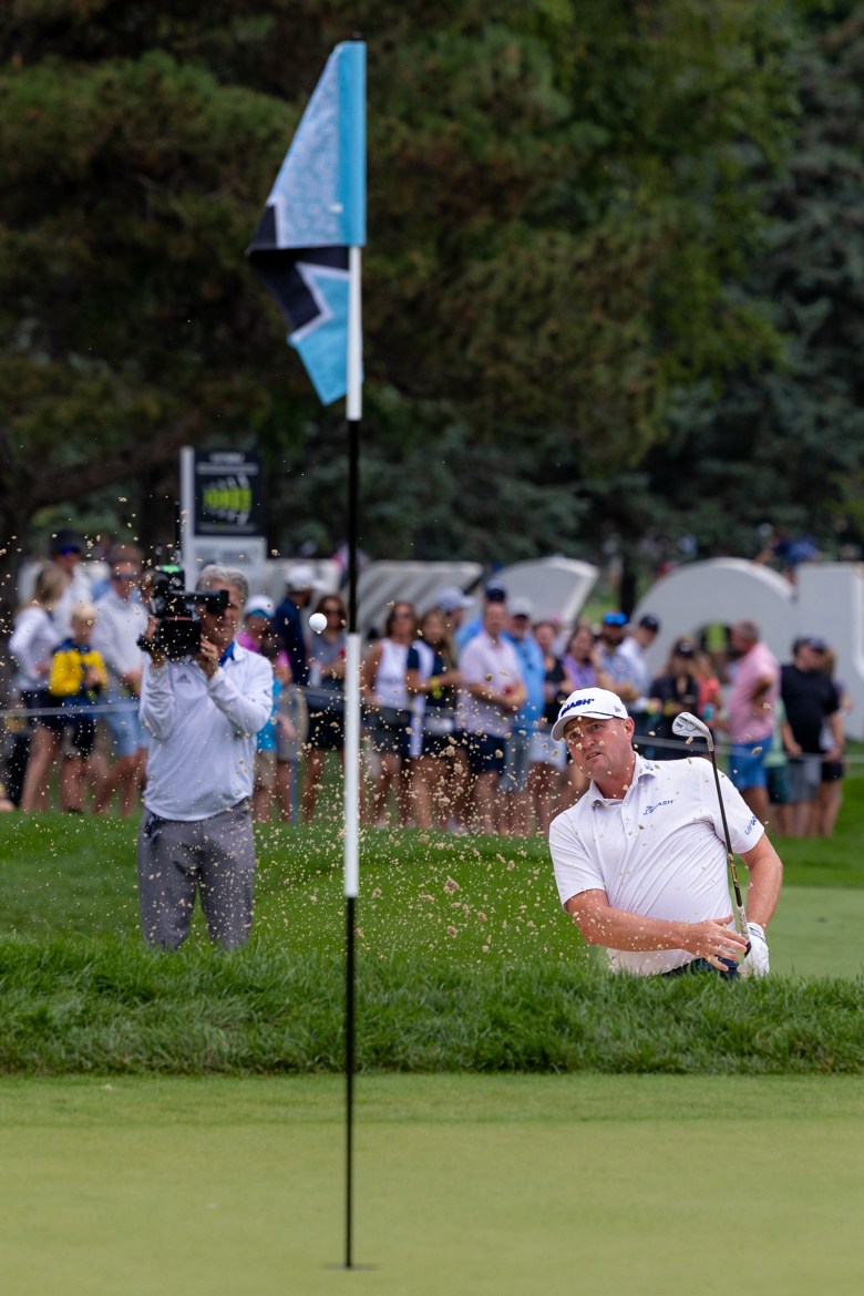 Jason Kokrak chips a golf ball.