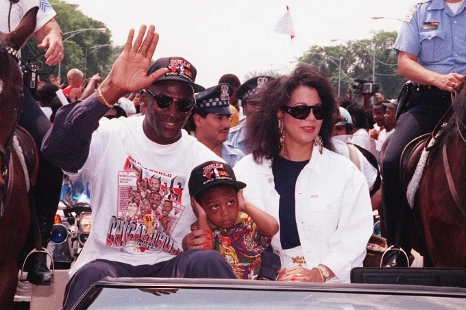 Michael Jordan with Juanita Vanoy and their son Jeffrey. Photo by AP