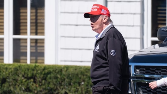 President Donald Trump walks at the Trump National Golf Club in Sterling, Va., Saturday. (AP)