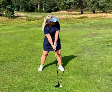 Carly Cummins using a mini driver off the fairway