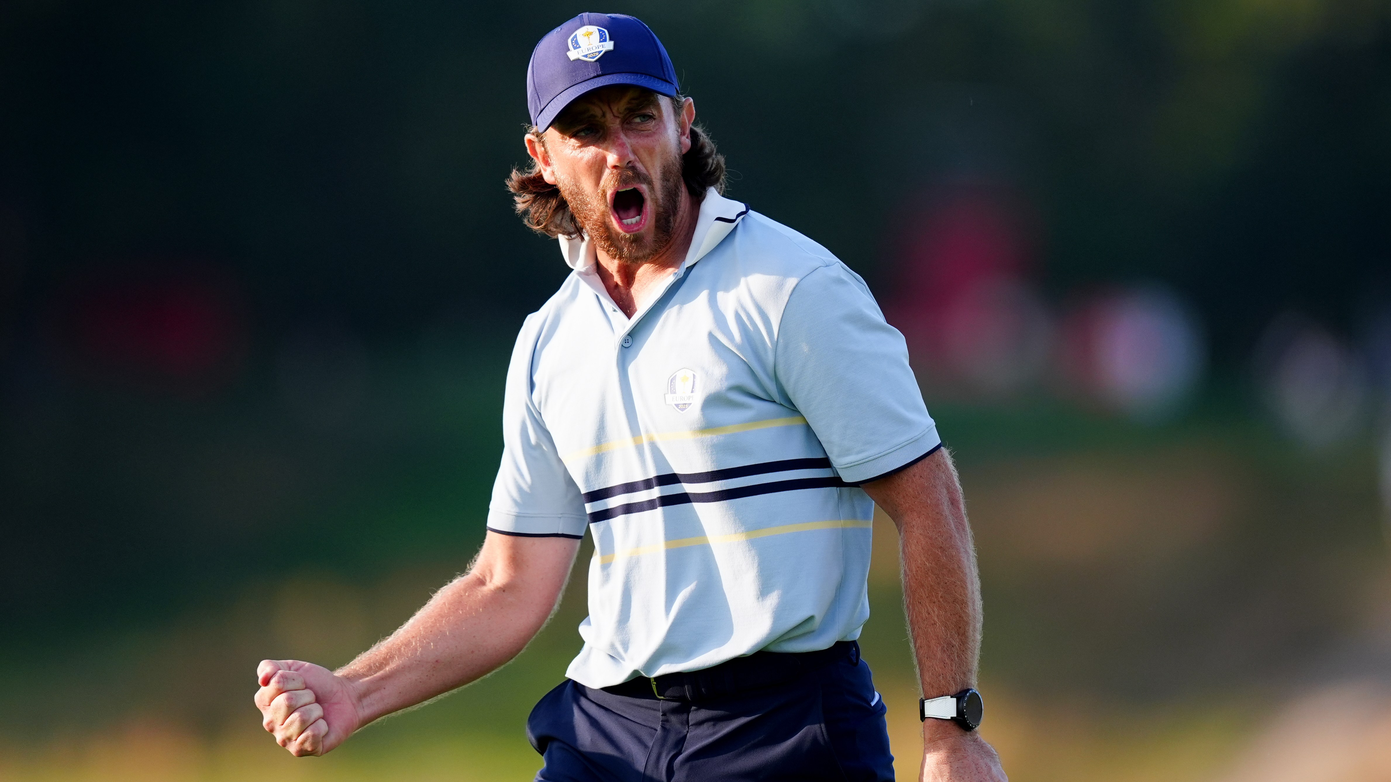 Tommy Fleetwood of Team Europe reacts with a shout and clenched fist following a putt during the Ryder Cup.