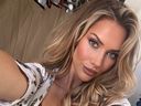 Golf influencer Paige Spiranac poses for a selfie.