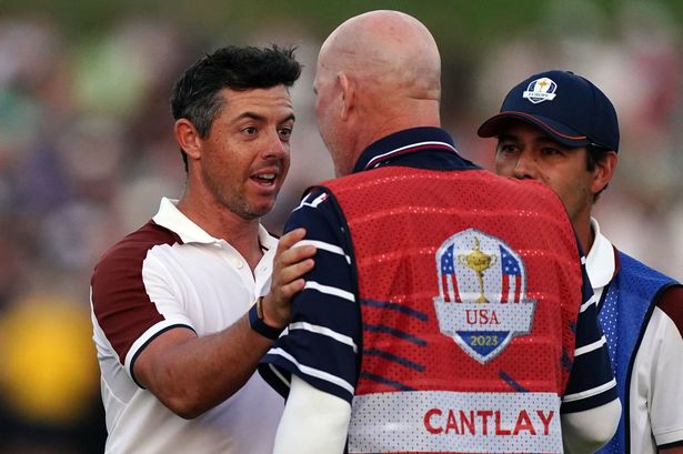 Rory McIlroy exchanging words with Patrick Cantlay's caddie Joe LaCava