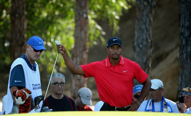Tiger Woods of the USA selects a club on the 11th green during the final round of the 2013 Turkish Airlines Open on the Montgomerie Maxx Royal Course  on November 10, 2013 in Antalya, Turkey.  