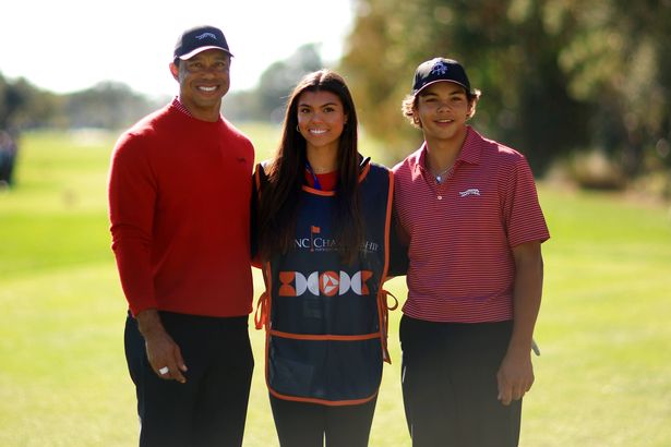Tiger Woods of the United States with his son Charlie Woods and daughter Sam Woods stand on the first tee during the second round of the PNC Championship at Ritz-Carlton Golf Club on December 22, 2024 in Orlando, Florida. 