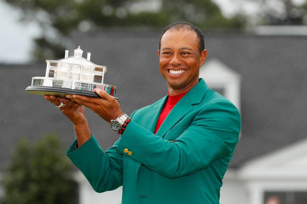 AUGUSTA, GEORGIA - APRIL 14: Tiger Woods of the United States celebrates with the Masters Trophy during the Green Jacket Ceremony after winning the Masters at Augusta National Golf Club on April 14, 2019 in Augusta, Georgia. (Photo by Kevin C. Cox/Getty Images)
