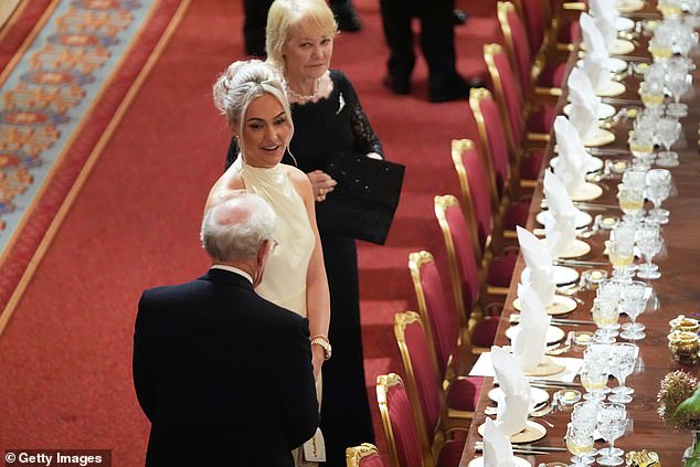 The British golfer cut a elegant figure on a gold halter neck gown at Windsor Castle