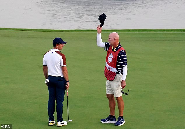 The caddie had riled up the Northern Irishman with his celebration on the 18th green
