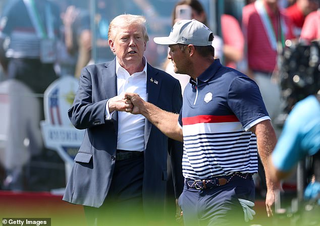Trump fist bumps DeChambeau as the American prepares for his fourball match
