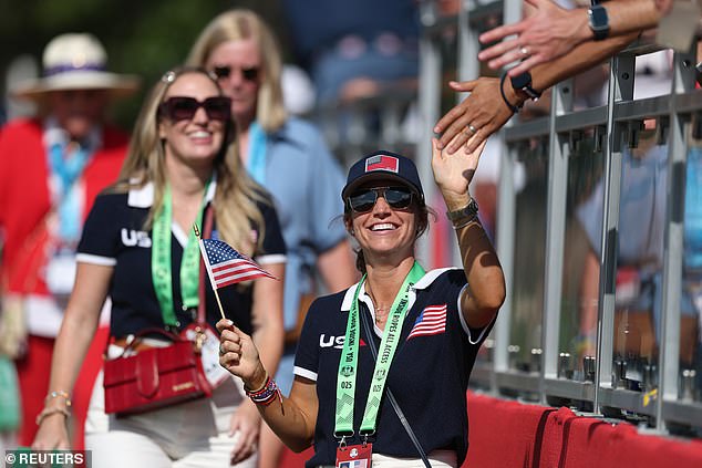 The American WAGs (seen here, Meredith Scheffler) coordinated their outfits to support them