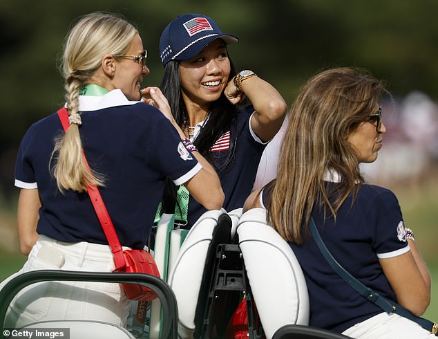 Katherine Morikawa (center) watches husband Collin Morikawa in the morning foursomes