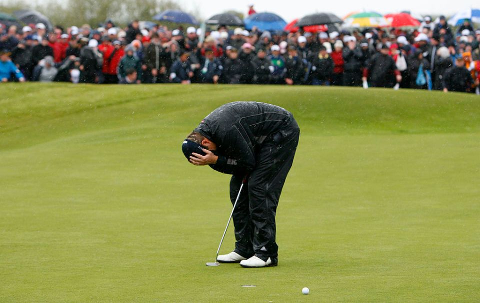 Irish amateur Shane Lowry reacts after missing a putt on the 18th green during the final round of the Irish Open at Baltray in County Louth, Ireland on May 17, 2009. Lowry played three playoff rounds to against England's Robert Rock to win the Irish Open.  AFP PHOTO/c (Photo credit should read PETER MUHLY/AFP via Getty Images)