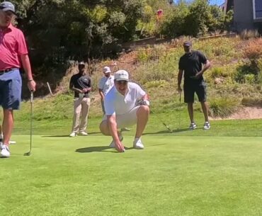 Rod Higgins' Group Dances after making putt at the Gary Payton Glove Foundation Golf Tournament