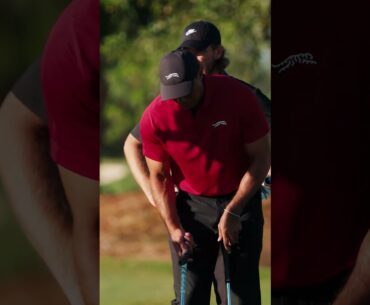 Tiger Woods with the most nonchalant 3-yard flop shot you'll ever see.