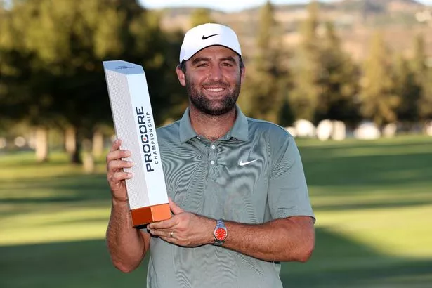 Scottie Scheffler of the United States poses with the trophy after his winning round on the 18th hole during the final round of the Procore Championship 2025