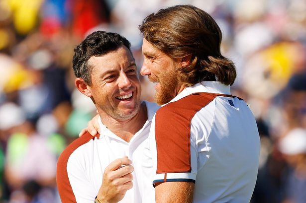 Rory McIlroy and Tommy Fleetwood of Team Europe celebrate winning their match