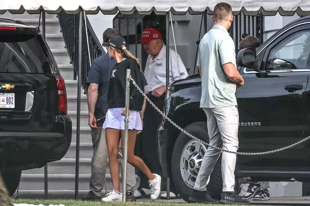 Donald Trump and Kai Trump outside their motorcade