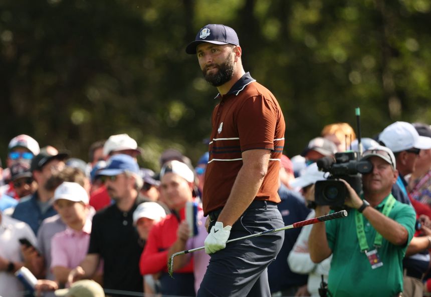  Team Europe's Jon Rahm reacts on the 13th hole during the foursomes