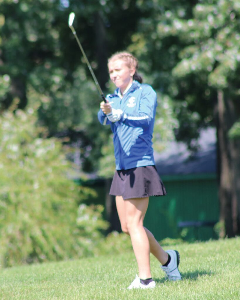 Imlay City’s Kendall Jones watches her chip shot fly toward the green at the end of the front nine at Castle Creek Golf Course on Sept. 8.