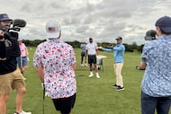 Matt Scharff of Good Good Golf gets ready to tee off at the driving range with Dallas...