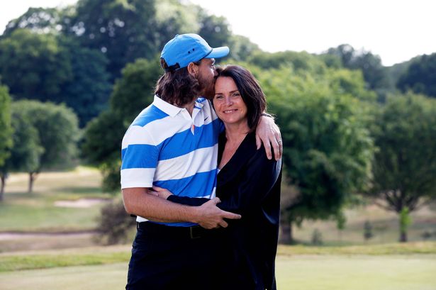 Tommy Fleetwood kisses his wife