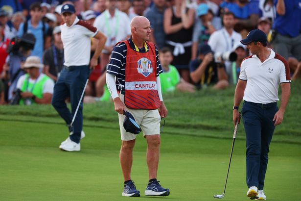 Rory McIlroy looks back at Joe LaCava