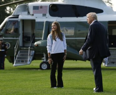 WASHINGTON, DC: US President Donald Trump and his granddaughter, Kai Trump, walk to Marine One on the South Lawn of the White House as they prepare to depart September 26, 2025 in Washington, DC. -- AFP