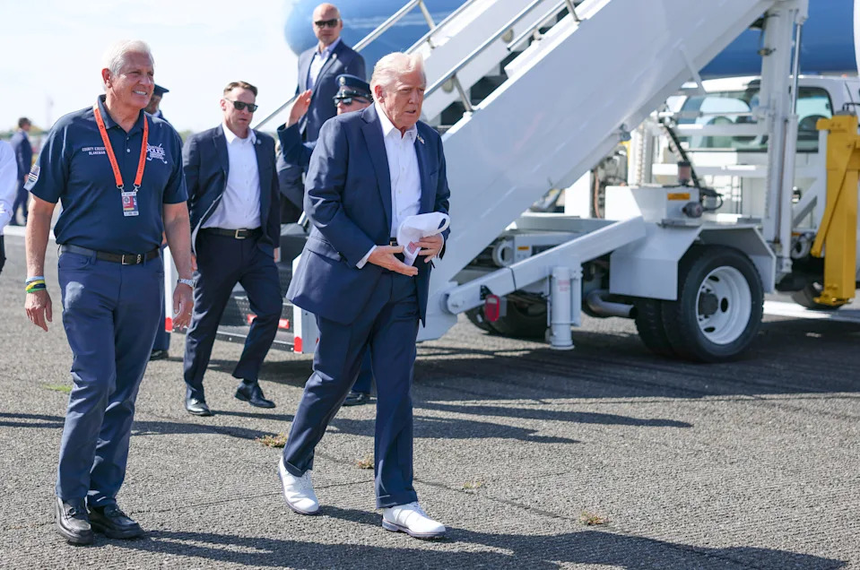 U.S. President Donald Trump walks with Bruce Blakeman, County Executive of Nassau County, New York, after arriving at the Republic Airport on Air Force One on September 26, 2025 in Farmingdale, New York. Trump spent the day attending the first day of the 2025 Ryder Cup.