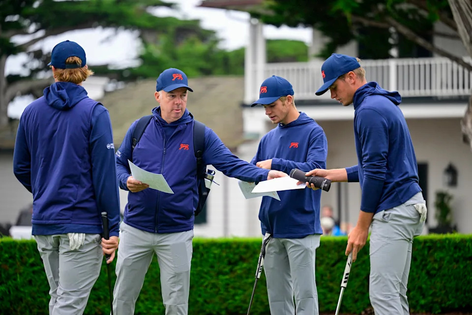 Team Captain Dean Robertson (GB&I) hands out course maps to teammates during a practice round of the 2025 Walker Cup at Cypress Point Club in Pebble Beach, Calif. on Thursday, Sept. 4, 2025.