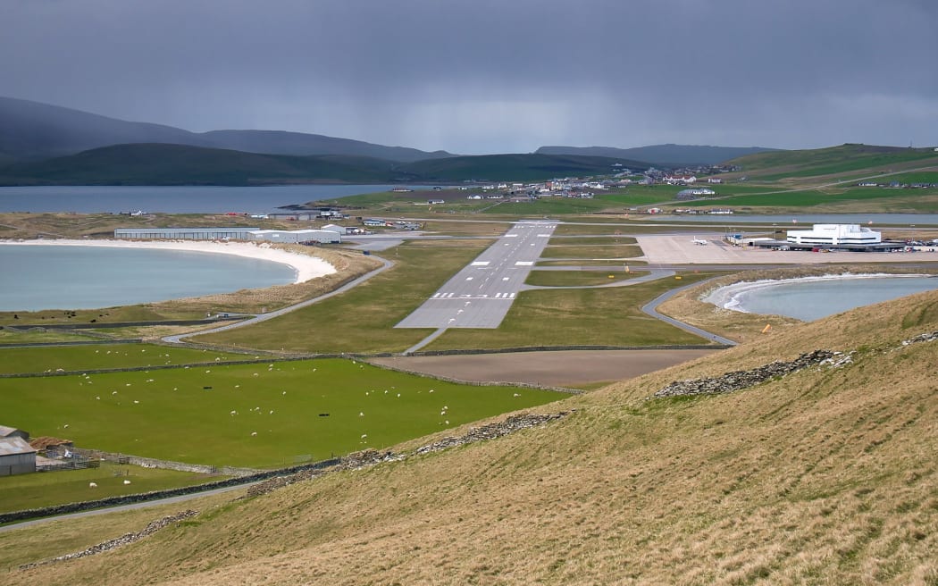 The road south from Lerwick cuts across the runway of Sumburgh Airport on Shetland.