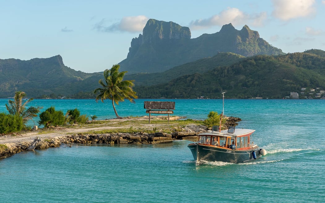 At Bora Bora airport you'll land on a thin motu (island) in a lagoon and take a boat from baggage claim.