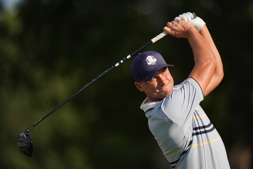 Europe's Ludvig Åberg watches his tee shot on the 12th hole at Bethpage Black golf course...