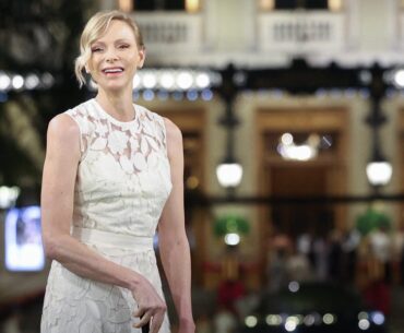 Princess Charlene of Monaco Golfs in White Lace Dress